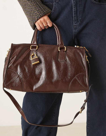 https://images.asos-media.com/products/mango-lock-charm-city-bag-in-deep-brown/209542399-4?$n_750w$&wid=750&fit=constrain