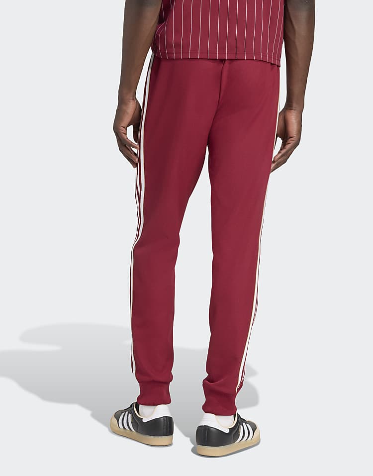 https://images.asos-media.com/products/adidas-originals-arsenal-terrace-icons-track-pants-in-team-coll-burgundy-2/209558079-3?$n_750w$&wid=750&fit=constrain