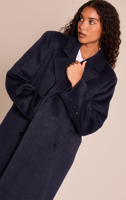 https://cdn-img.prettylittlething.com/3/f/a/1/3fa1f1bb5af98d28deef1c4733b36c542b58c6a7_CNN8428_4_navy_structured_double_breasted_wool_look_maxi_coat.jpg