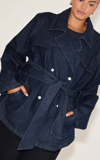https://cdn-img.prettylittlething.com/5/2/e/0/52e055cb424bb7f86c58dea09e503ea4d8b975d1_CNN6034_4_plus_indigo_cropped_belted_denim_trench.jpg