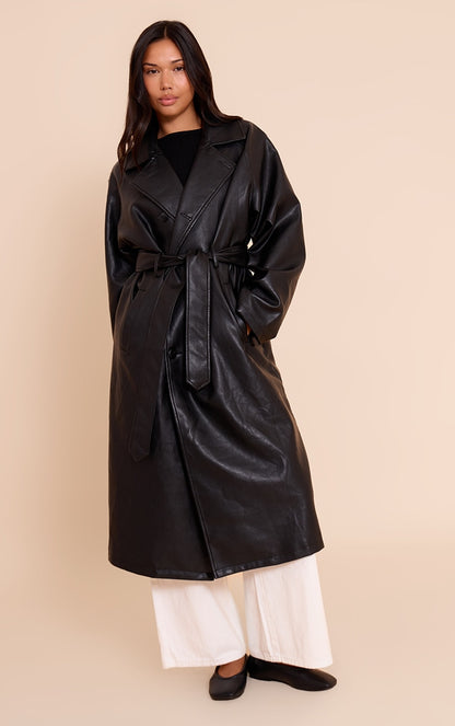 https://cdn-img.prettylittlething.com/5/3/2/6/5326dc7dbef879134ffd08621ca146e1bb826a40_CNN8571_1_black_faux_leather_maxi_trench_coat.jpg