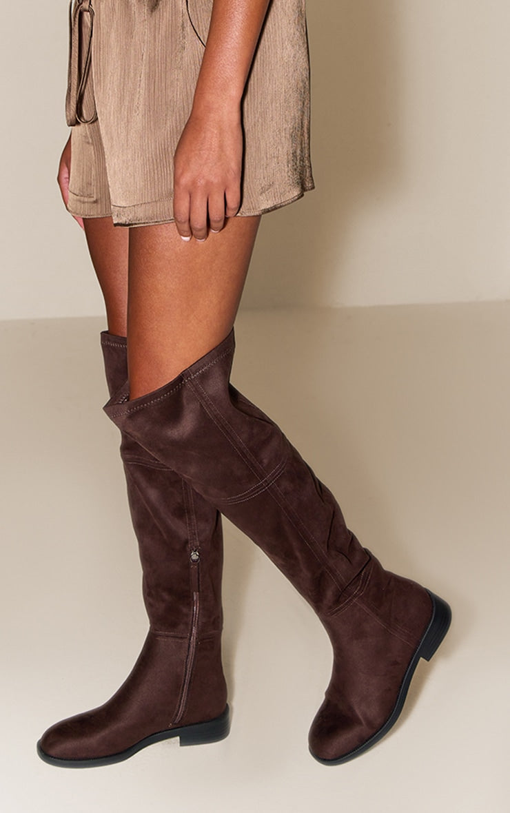 https://cdn-img.prettylittlething.com/5/7/d/e/57de7580d083b446456d32864c4cd36c956be923_CNN5169_1_chocolate_faux_suede_round_toe_riding_knee_high_boot.jpg