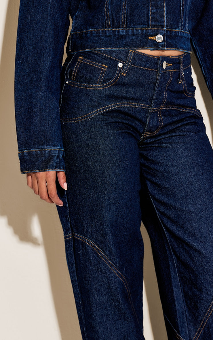 https://cdn-img.prettylittlething.com/6/1/c/c/61ccd9d22fbbd26e35dd449c227103d4bf33c5cd_CNN2896_4_indigo_western_seam_detail_jeans.jpg