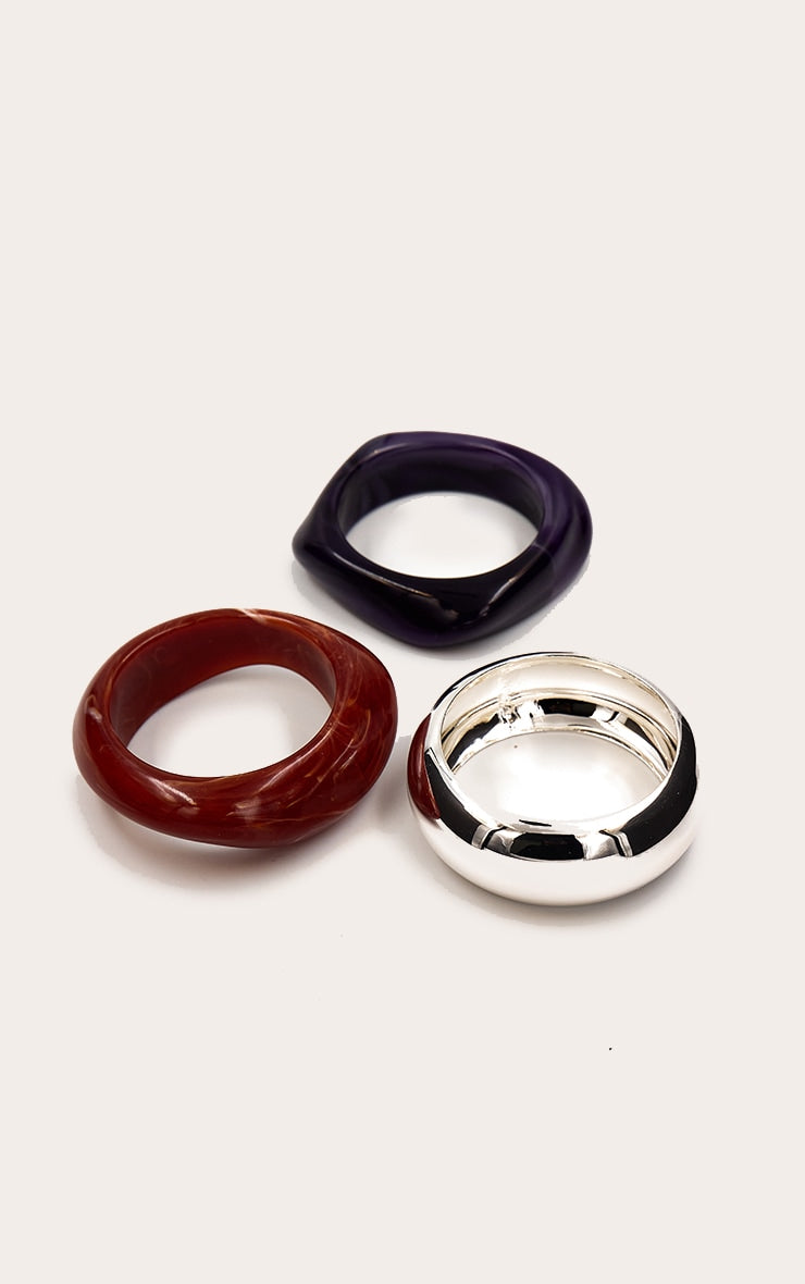 https://cdn-img.prettylittlething.com/6/3/7/4/63745c3230634ba677db83314343eb010c11bf0f_CNO2918_2_plum_silver_resin_bangle_multi_pack.jpg