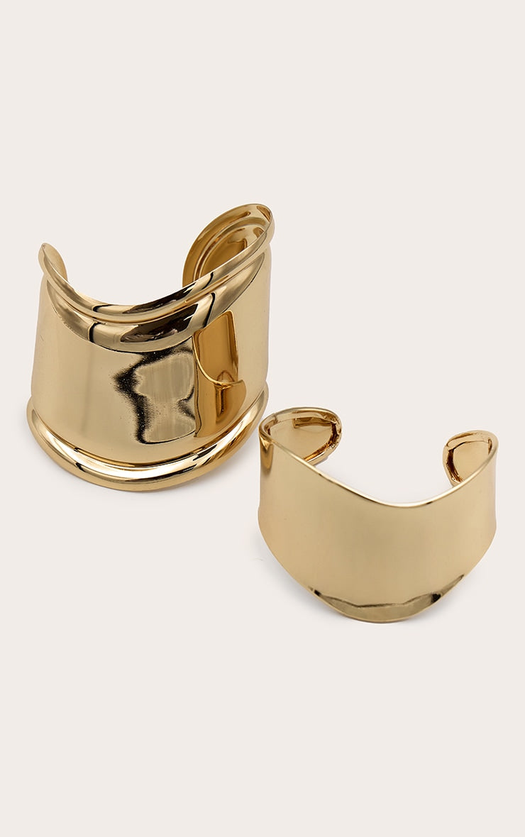 https://cdn-img.prettylittlething.com/6/a/8/4/6a84f4cb2aa70c241c57f5f716bd14a1863b2d7f_CNG4856_2_gold_curved_bangle_set.jpg