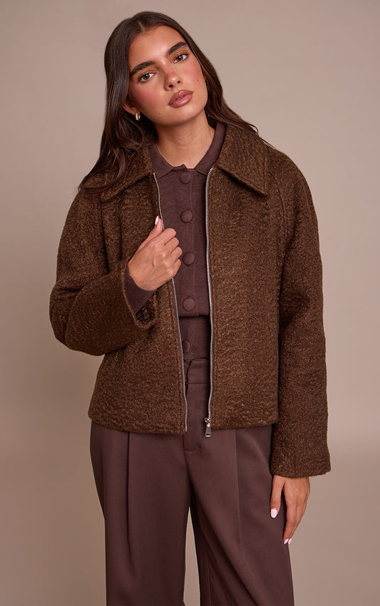 https://cdn-img.prettylittlething.com/6/d/2/3/6d23bafff1544a49f19619057ee204897839c824_CNN8436_1_chocolate_boucle_zip_up_jacket.jpg