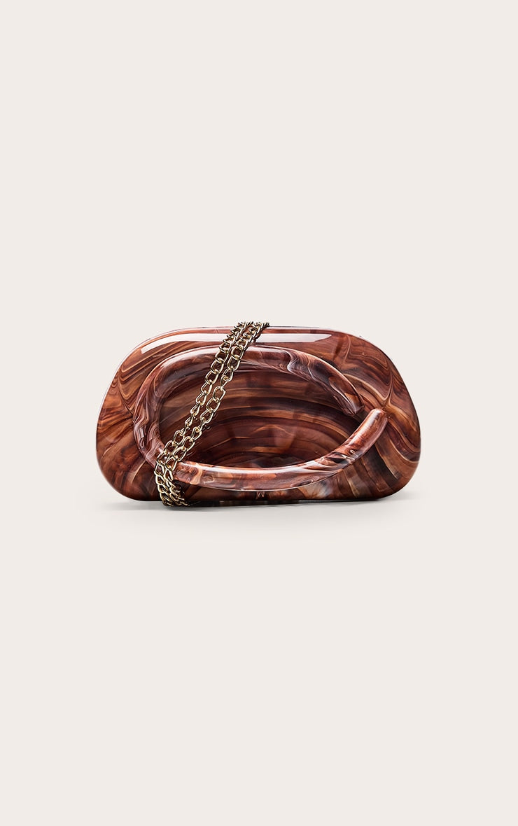 https://cdn-img.prettylittlething.com/6/e/b/9/6eb9bcd8a2e17808a45ed0e22cfb8f2e0eeffa8e_CNO2875_3_chocolate_marble_hard_resin_clutch_bag.jpg