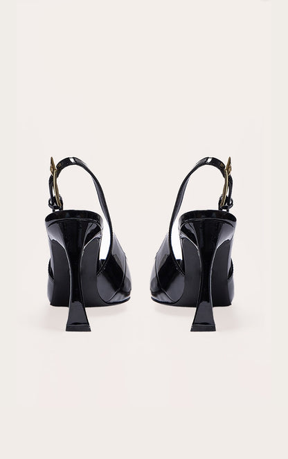https://cdn-img.prettylittlething.com/7/1/1/f/711f671b4e4e0607853bc859d4277827725b7dbc_CNJ8456_3_black_patent_pu_gold_buckle_high_stiletto_court_heels.jpg