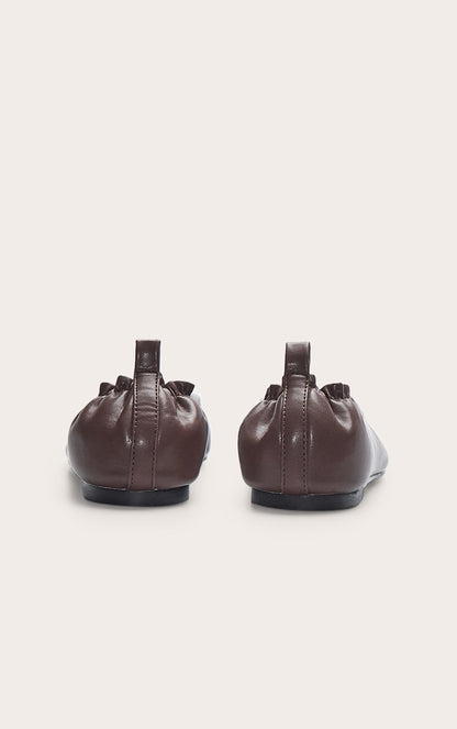 https://cdn-img.prettylittlething.com/7/6/e/5/76e50a63312ac6455168f1af59a136ca0748a09c_CNN0446_3_chocolate_pu_asymmetric_square_toe_ballet_pump.jpg