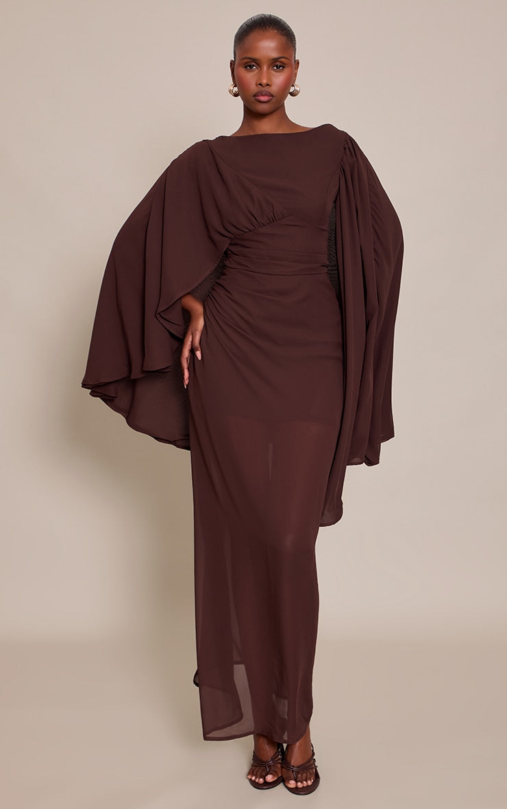 https://cdn-img.prettylittlething.com/8/7/d/d/87ddd88e4a30b23d1b0b1d2e695b66e205d8aafe_CNP0922_1_chocolate_chiffon_cape_detail_maxi_dress.jpg