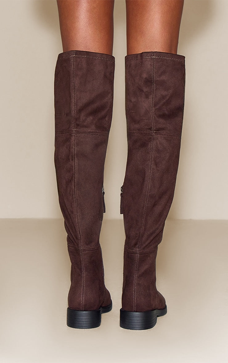 https://cdn-img.prettylittlething.com/9/8/9/0/98904c51992c4e4d0a9c1a94686908ab5840e50a_CNN5169_4_chocolate_faux_suede_round_toe_riding_knee_high_boot.jpg