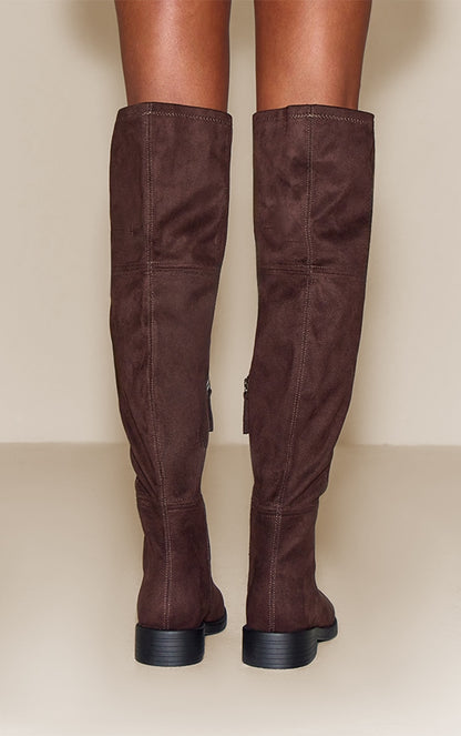 https://cdn-img.prettylittlething.com/9/8/9/0/98904c51992c4e4d0a9c1a94686908ab5840e50a_CNN5169_4_chocolate_faux_suede_round_toe_riding_knee_high_boot.jpg