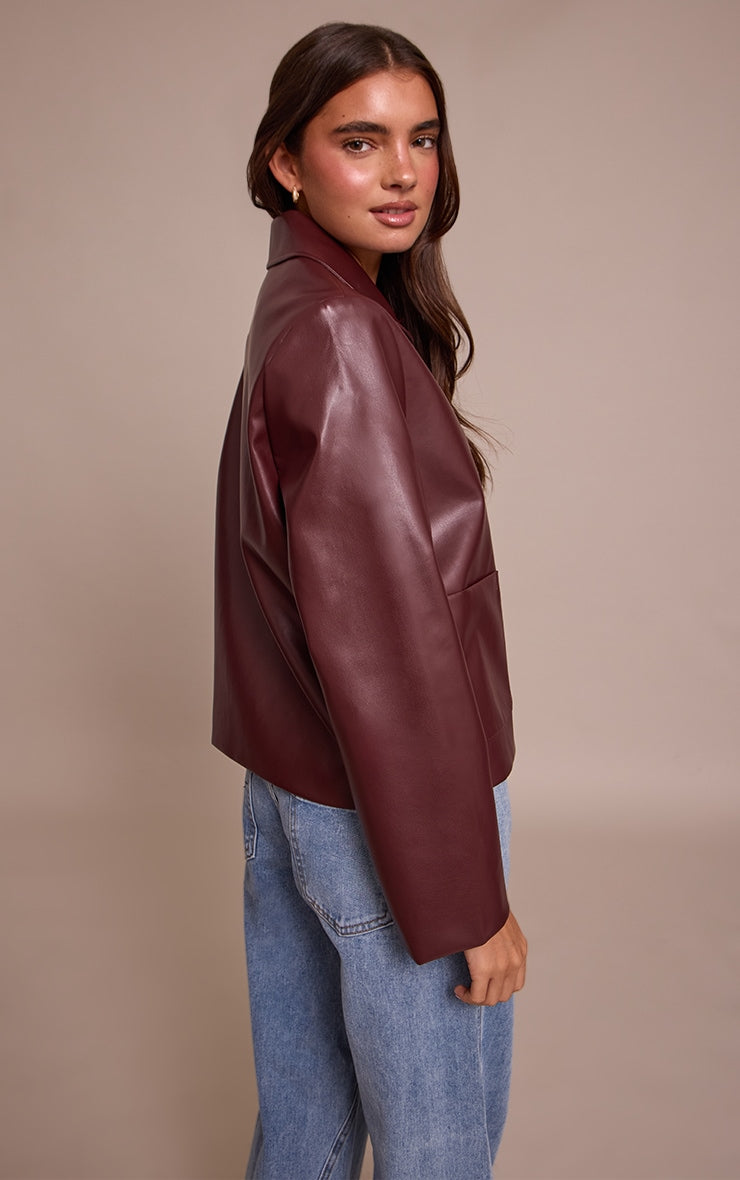 https://cdn-img.prettylittlething.com/9/a/4/5/9a4521025ea86e397b3ad484d0af483bba3bbede_CNN8424_2_burgundy_pu_button_up_jacket.jpg