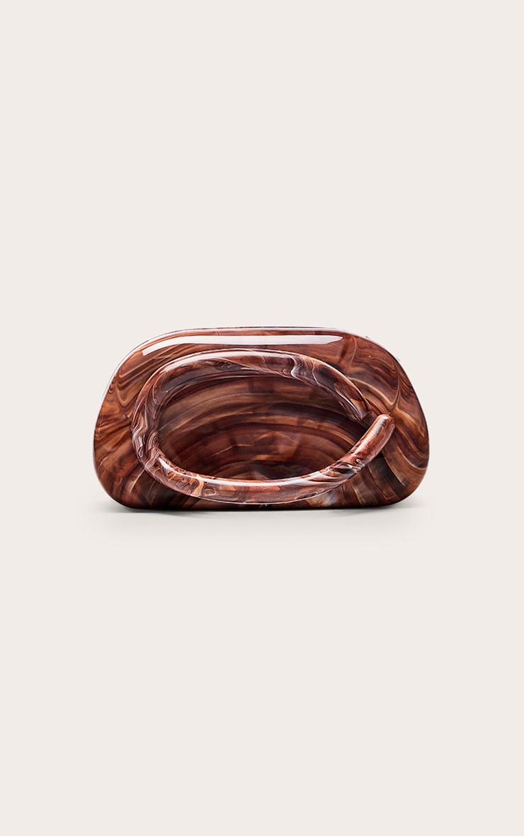 https://cdn-img.prettylittlething.com/9/f/8/5/9f854d5061c71de4055a7474dab733df557d00dd_CNO2875_2_chocolate_marble_hard_resin_clutch_bag.jpg