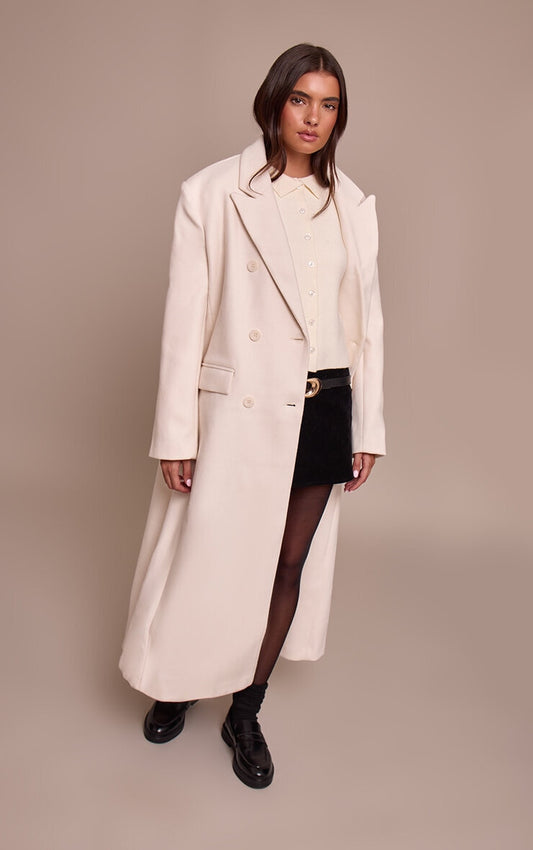 https://cdn-img.prettylittlething.com/9/f/a/3/9fa3ca869684d047b7ba877a300bd613516684c2_CNN6957_1_ecru_double_breasted_oversized_style_structured_coat.jpg
