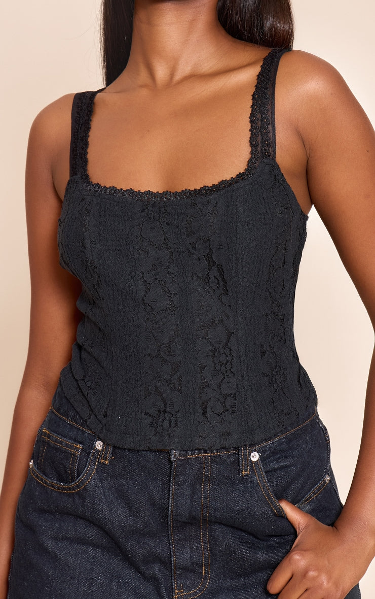 https://cdn-img.prettylittlething.com/a/e/1/6/ae16fba10c3c78565e2f647f7fdb5e07c281fadf_CNO0756_4_black_lace_detail_strappy_cropped_corset_top.jpg