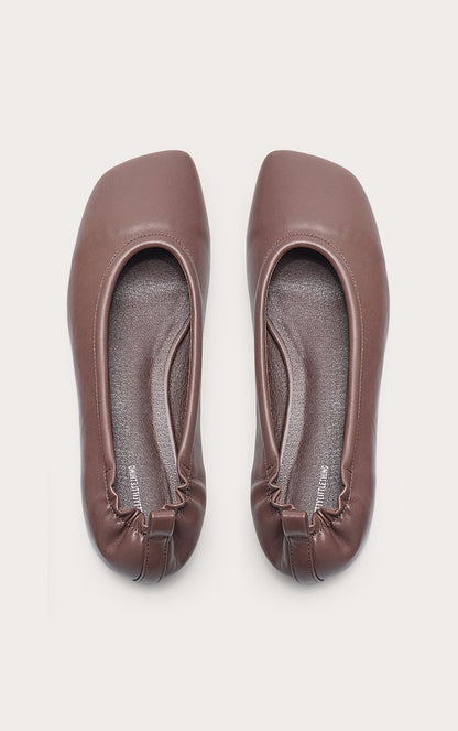 https://cdn-img.prettylittlething.com/b/8/c/a/b8caeb909da1c720c9d50794bce78315c5f97c99_CNN0446_5_chocolate_pu_asymmetric_square_toe_ballet_pump.jpg