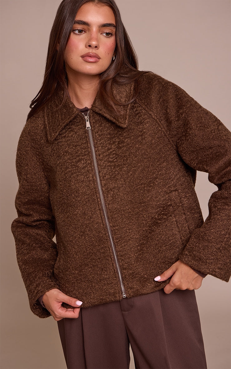 https://cdn-img.prettylittlething.com/b/e/a/2/bea2cf8abc31ba22ae8b1976f20c197602a2807a_CNN8436_4_chocolate_boucle_zip_up_jacket.jpg