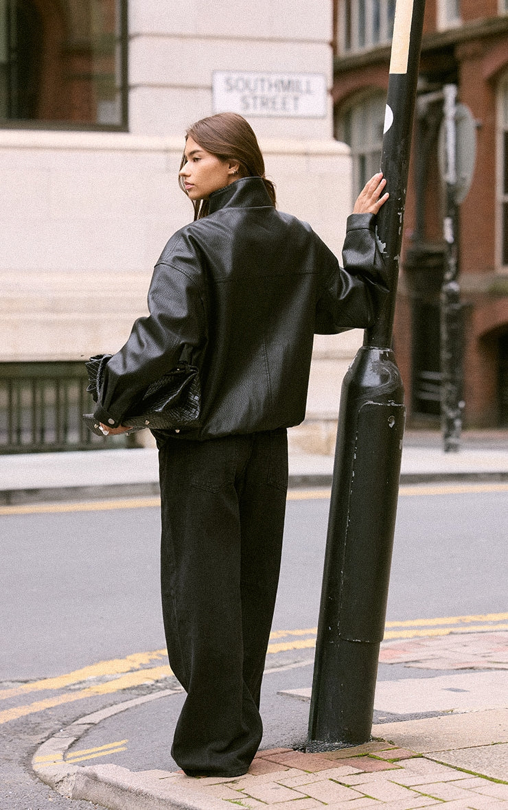 https://cdn-img.prettylittlething.com/c/a/0/b/ca0bfc15274022ac93b9c5b9fd5c3dc22e73b99d_CNO0273_2_black_funnel_neck_concealed_placket_faux_leather_jacket.jpg