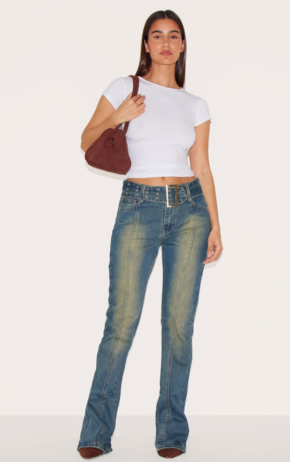 https://cdn-img.prettylittlething.com/d/b/a/d/dbad8fb8d45bd7d82d7500e4301153ee91c8c227_CNA3231_1_indigo_vintage_wash_belted_seam_front_flare_jeans.jpg