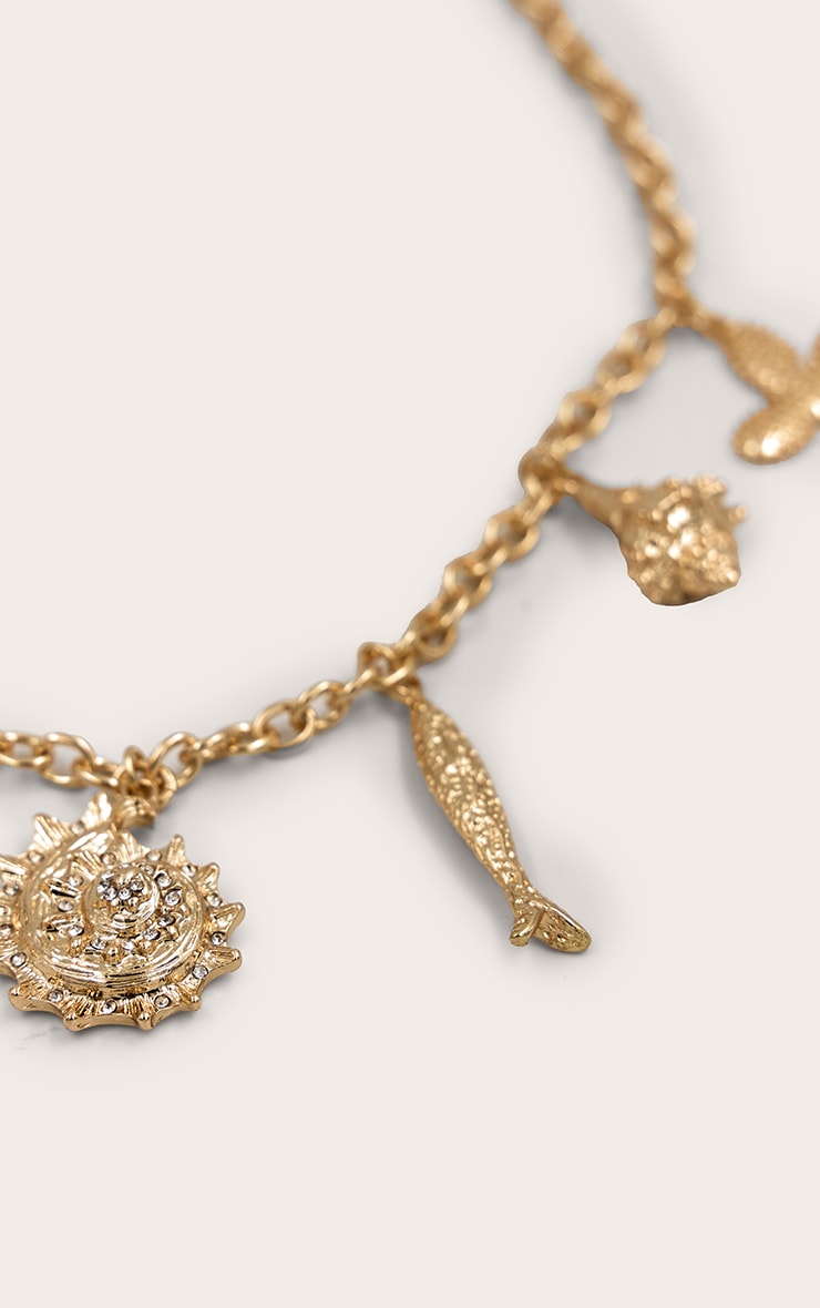 https://cdn-img.prettylittlething.com/e/b/b/7/ebb70cce2ef8ecdfc86c0df20b3e87bab1cb9ef0_CNO2975_3_gold_multi_shell_pendant_chain_necklace.jpg
