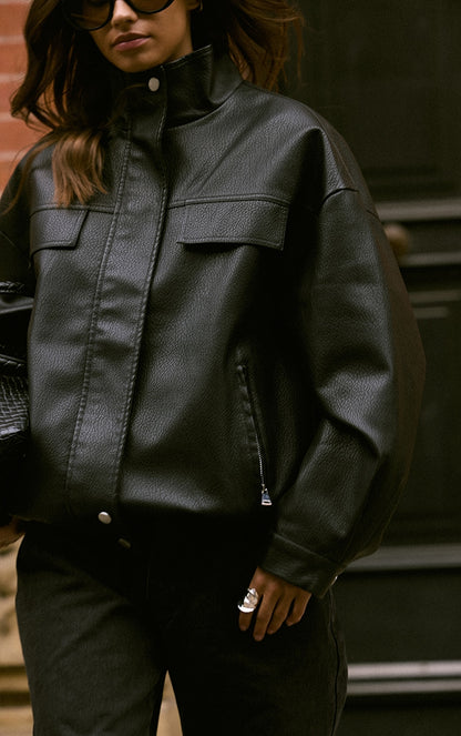 https://cdn-img.prettylittlething.com/f/6/3/9/f63940d0e9cc85d797f72eaacc4a99bcee8419de_CNO0273_4_black_funnel_neck_concealed_placket_faux_leather_jacket.jpg